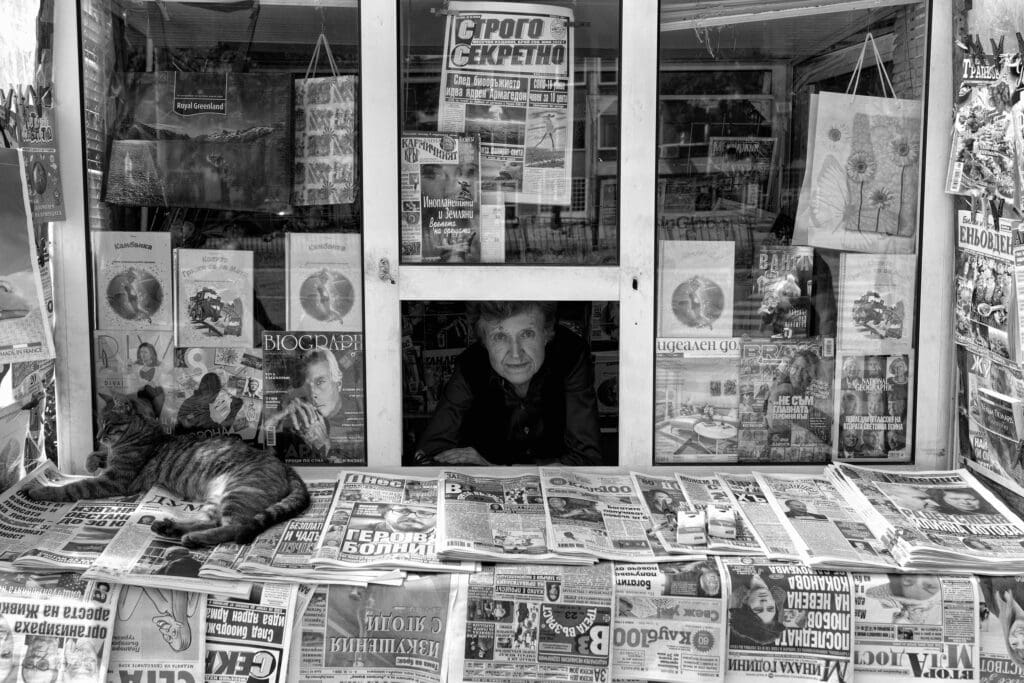 Captivating photo - Newsstand woman and cat - Plovdiv, Bulgaria